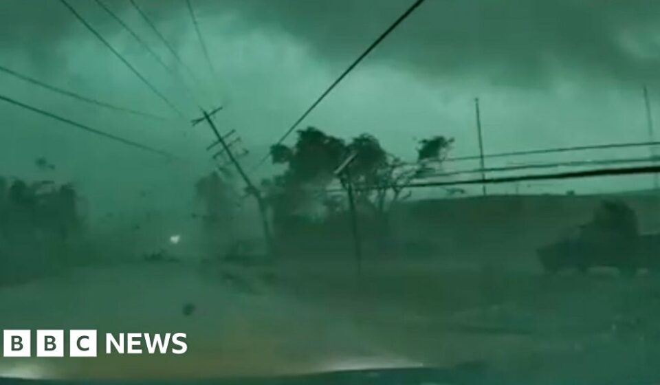Dashcam captures tornado toppling power lines onto car