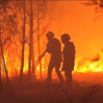French firefighters battle the blaze with local residents through the night