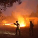 French firefighters work tirelessly to stop blaze from spreading