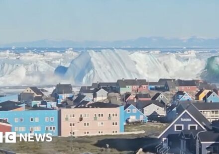 Giant iceberg turns over near Greenland's coast