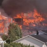 Helicopters dump water as huge Norway fire destroys homes