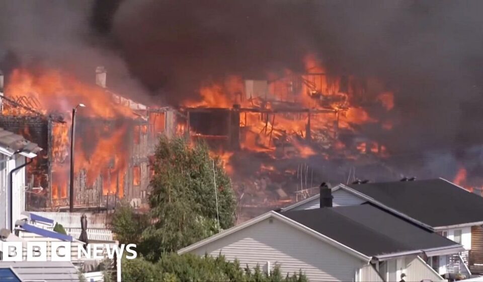 Helicopters dump water as huge Norway fire destroys homes