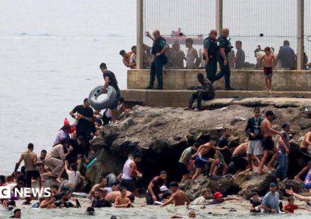 Hundreds of migrants swim from Morocco to Spanish enclave of Ceuta