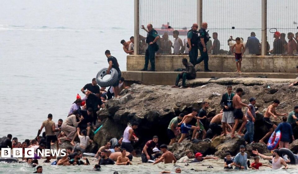 Hundreds of migrants swim from Morocco to Spanish enclave of Ceuta