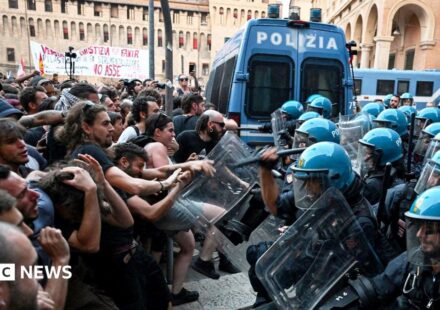 Italy protests: Dozens hurt in Bologna after man dies while being restrained by police