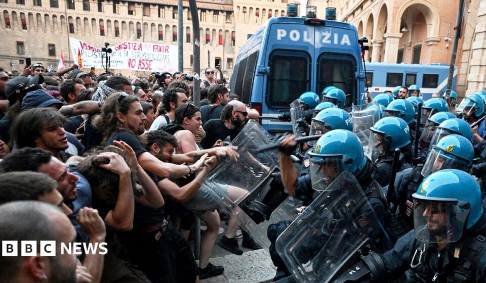 Italy protests: Dozens hurt in Bologna after man dies while being restrained by police
