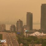 Orange haze from Canada wildfires seen in Ontario and northern US