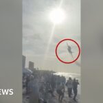 Watch: Moment US Navy Blue Angels stun packed beach with low flypast