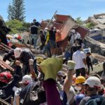 Anguish of Colombian brother at rubble of building being searched for earthquake survivors