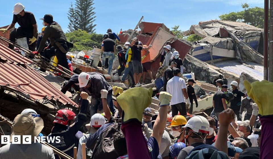 Anguish of Colombian brother at rubble of building being searched for earthquake survivors