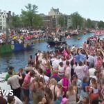 Crowds line Amsterdam's canals for Pride boat parade