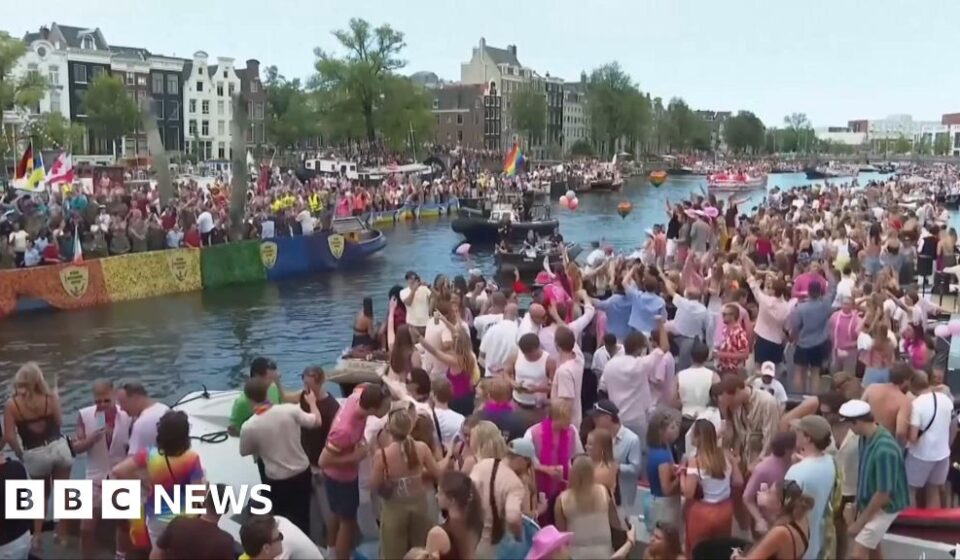 Crowds line Amsterdam's canals for Pride boat parade