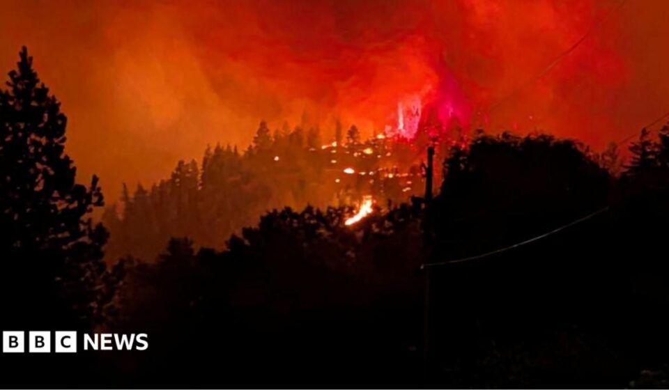 Fast-moving Canada wildfire doubles in size forcing thousands to flee homes
