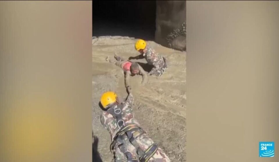 Nepal army races to rescue more than 100 trapped in hydropower tunnel after floods