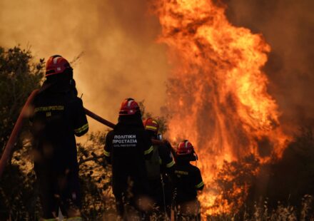 Pictures show firefighters battling raging wildfires in Greece