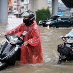 Bangkok roads submerged as flood disaster declared