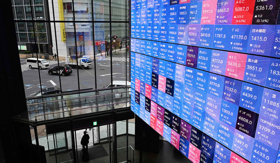 Japanese stocks rose as bond yields and the yen fell after rate hike
