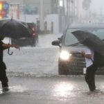 Millions urged to evacuate as Typhoon Dujuan hits Japan
