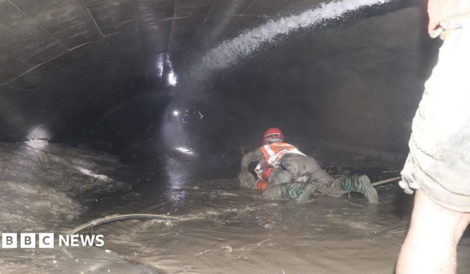 Nepal rescuers try to reach dozens trapped in tunnel after two pulled out alive