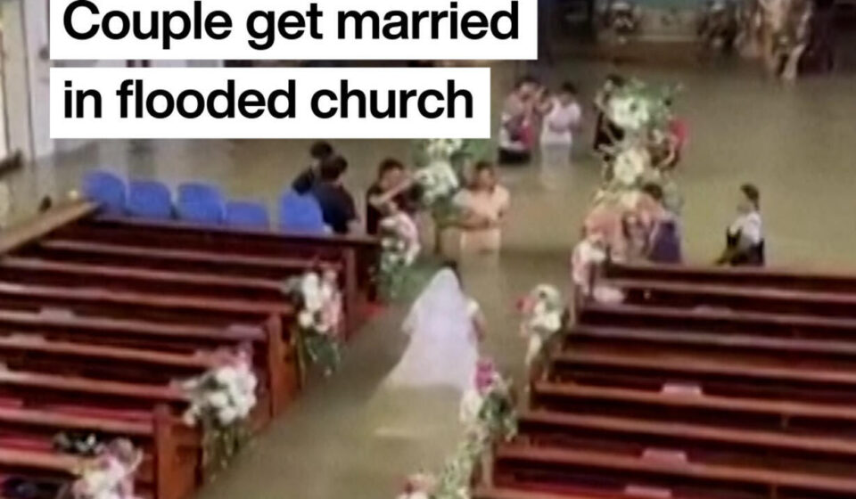 Philippine couple married in hip-deep floodwaters