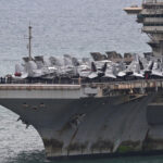 USS Abraham Lincoln aircraft carrier docks in Thailand after nine months at sea