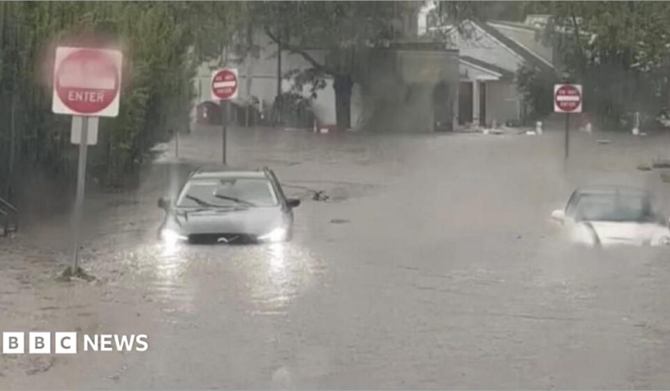 Watch: Flash flooding interrupts half-marathon, submerges cars