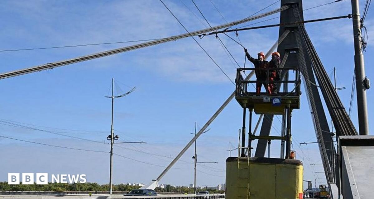 Kyiv bridge hit in further drone attack as German chancellor makes surprise visit