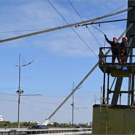 Kyiv bridge hit in further drone attack as German chancellor makes surprise visit