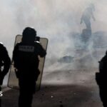 Teenager's hand blown off during confrontation between France school protesters and riot police